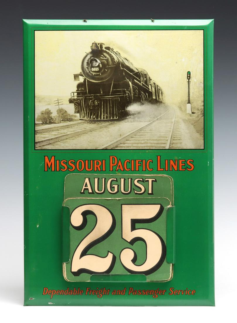 TWO MISSOURI PACIFIC TIN LITHO ADVERTISING CALENDARS: Each self-framed tin litho plaque with metal frame pocket having cardstock month and day placards to display each day of each month for any year. One pictures the MoPac Diesel Eagle and the other pict