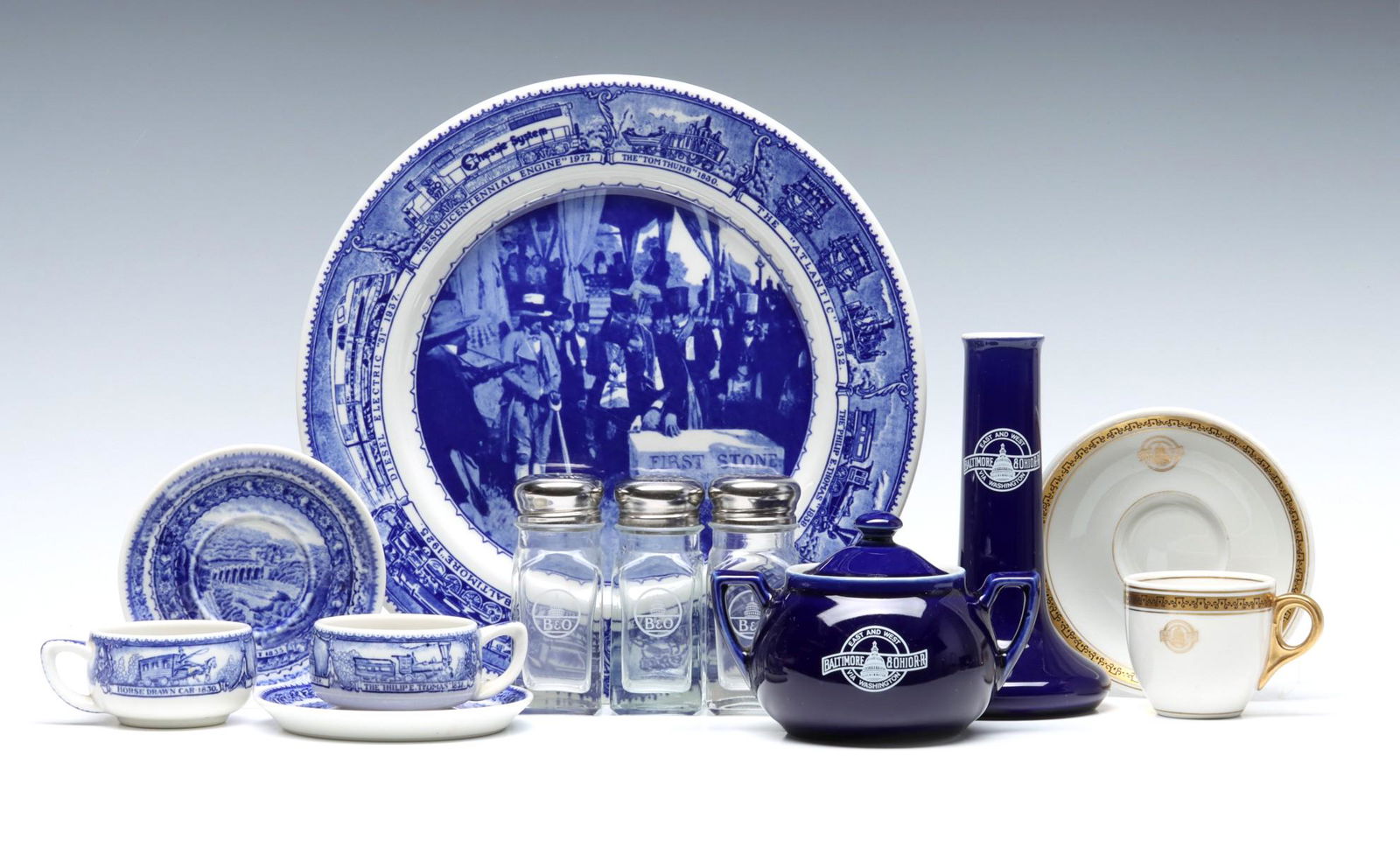 A COLLECTION OF BALTIMORE & OHIO RAILROAD DINING CHINA: B&O Railroad dining ware includes: two sets 'Centenary' pattern cups and saucers signed with Lamberton backstamps; Sesquicentennial pattern plate circa 1977; Black and gold 'Capitol' pattern cup and s