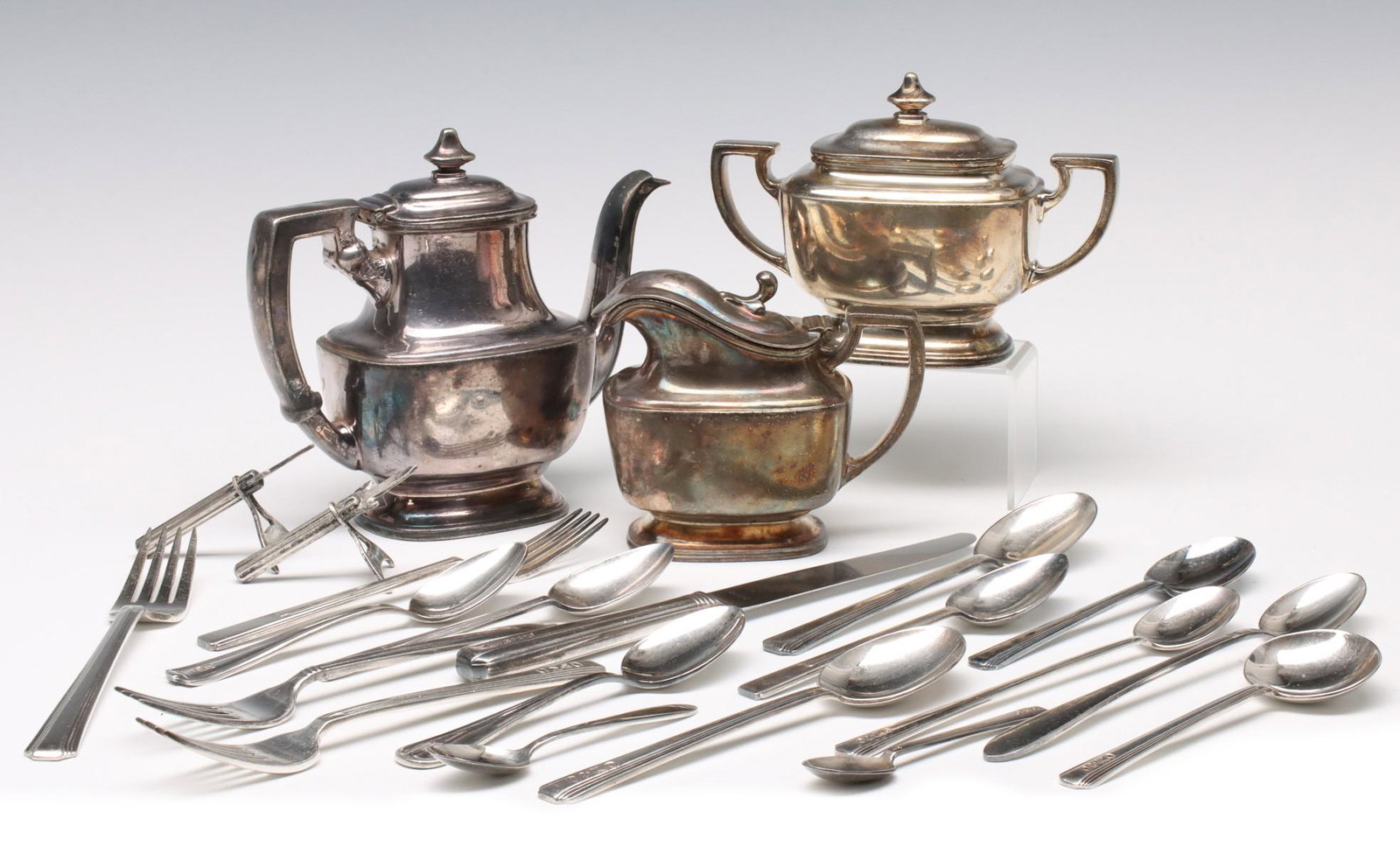 A SMALL COLLECTION OF RAILROAD SILVER PLATE: Flatware and hollow ware with markings that include Rock Island Railroad, Gulf, Mobile and Ohio Railroad, Canadian National System, Frisco Lines, Southern Pacific Railroad, Chicago Minneapolis and St.