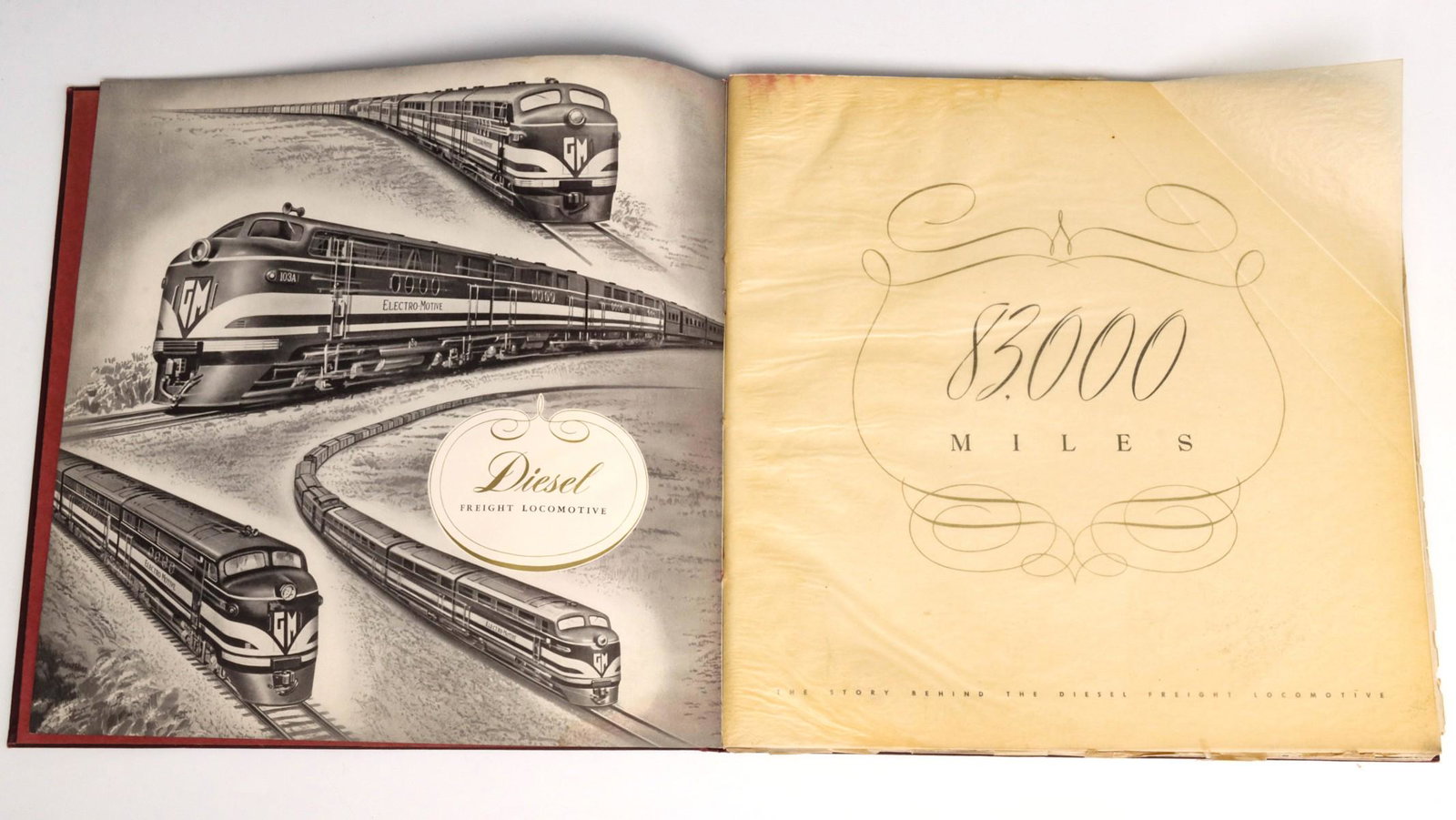 A BUDD COMPANY TRADE CATALOG & FREIGHT LOCOMOTIVE BOOK: The coil bound Budd car catalog paired with a book titled ''83,000 MILES'' which documents freight diesel locomotives of the day. We happily provide seamless in-house packing and shipping services on 