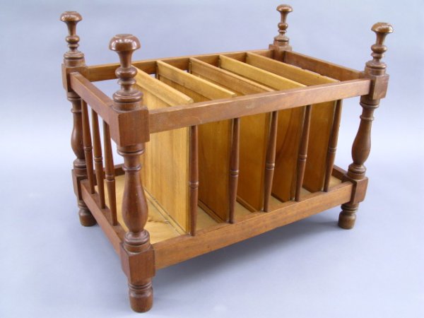 ANTIQUE WALNUT CRIB NOW A CANTERBURY: 19th century primitive walnut crib hand-converted into a nice Canterbury or magazine holder with five inner dividers, ornate carved posts and feet, measures approximately 19.5 x 23.5 x 14 inches overa