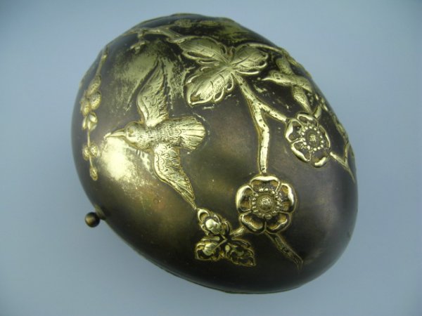 EGG FORM VICTORIAN JEWELRY CASKET: Measures approximately 5.25 x 6.5 x 5 inches, embossed gird and branches to lid, removable burgundy silk lining to top and bottom halves, Austrian maker marked GEBR. RODECK of Vienna, hinged, three ba