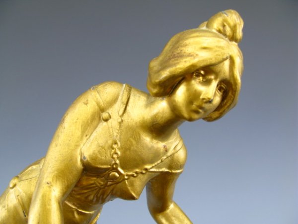 FIGURAL MAIDEN ART NOUVEAU PHOTO OR CARD HOLDER: A card or photo holder with 14 inch figural maiden. Measures approximately 14 x 12 x 6 inches, cast and gold painted, hollow figure holding divider for cards or photos.