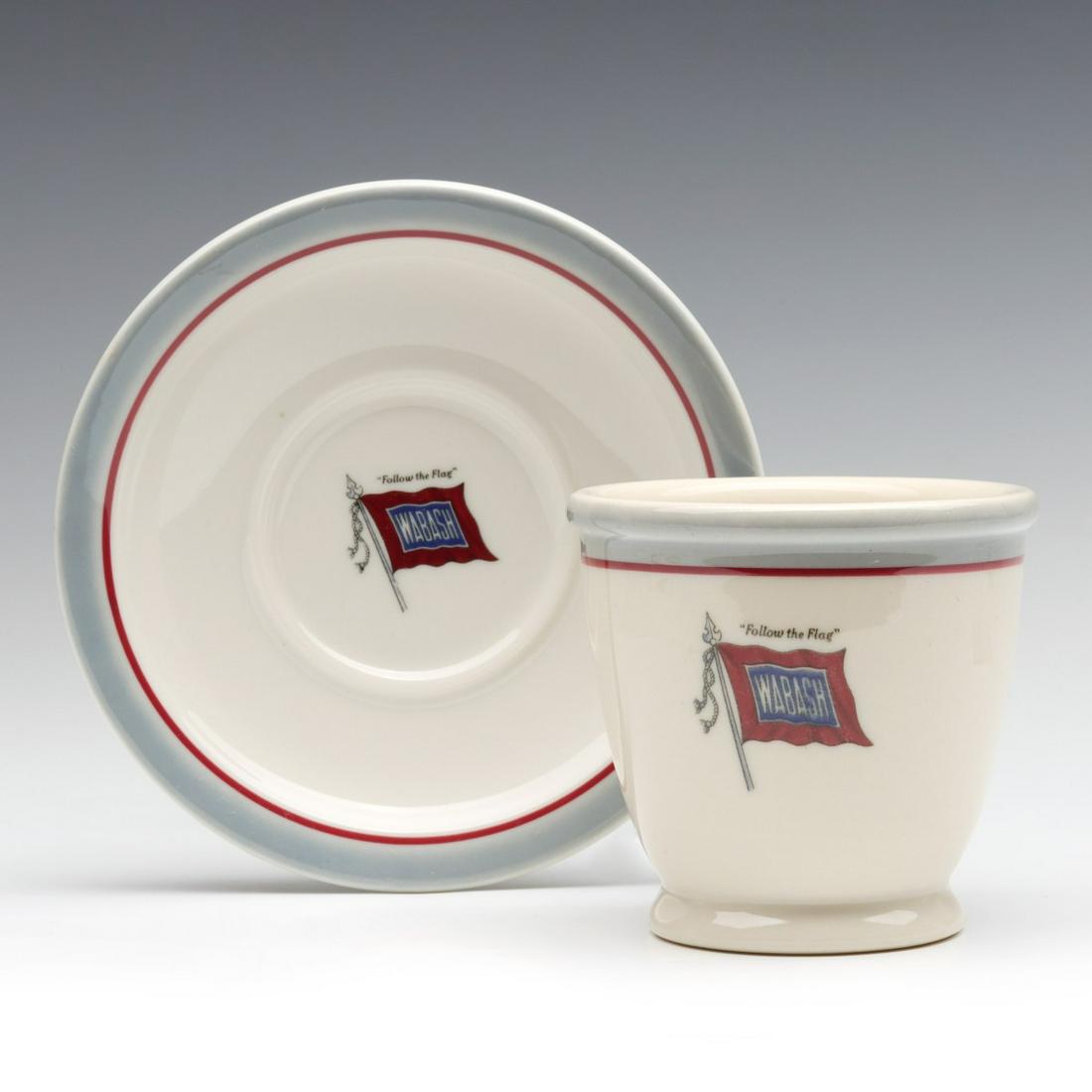 A RARE WABASH DOUBLE EGG CUP WITH UNDERPLATE: The double egg cup and underplate with Wabash Railroad Banner logo and color scheme; Syracuse China maker's back stamp. Underplate measures 5.25, cup is 3.125 inches. We happily provide seamless in-ho