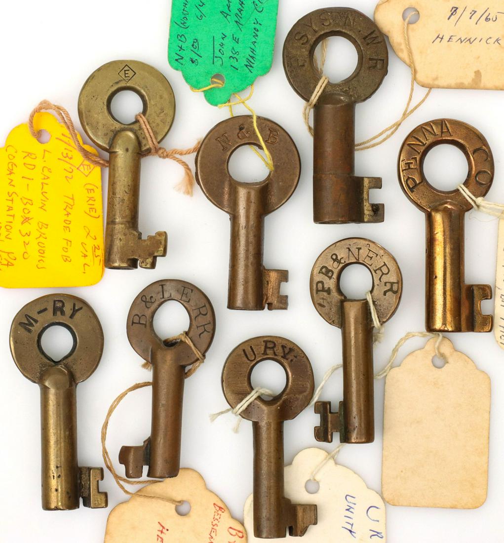A COLLECTION OF PENNSYLVANIA RAILROAD SWITCH KEYS: The eight brass switch keys with stamped markings: M-RY attributed to the Monongahela Railway Company; B&LERR for the Bessemer and Lake Erie Railroad; URY attributed to the Unity Railways Company; PB&