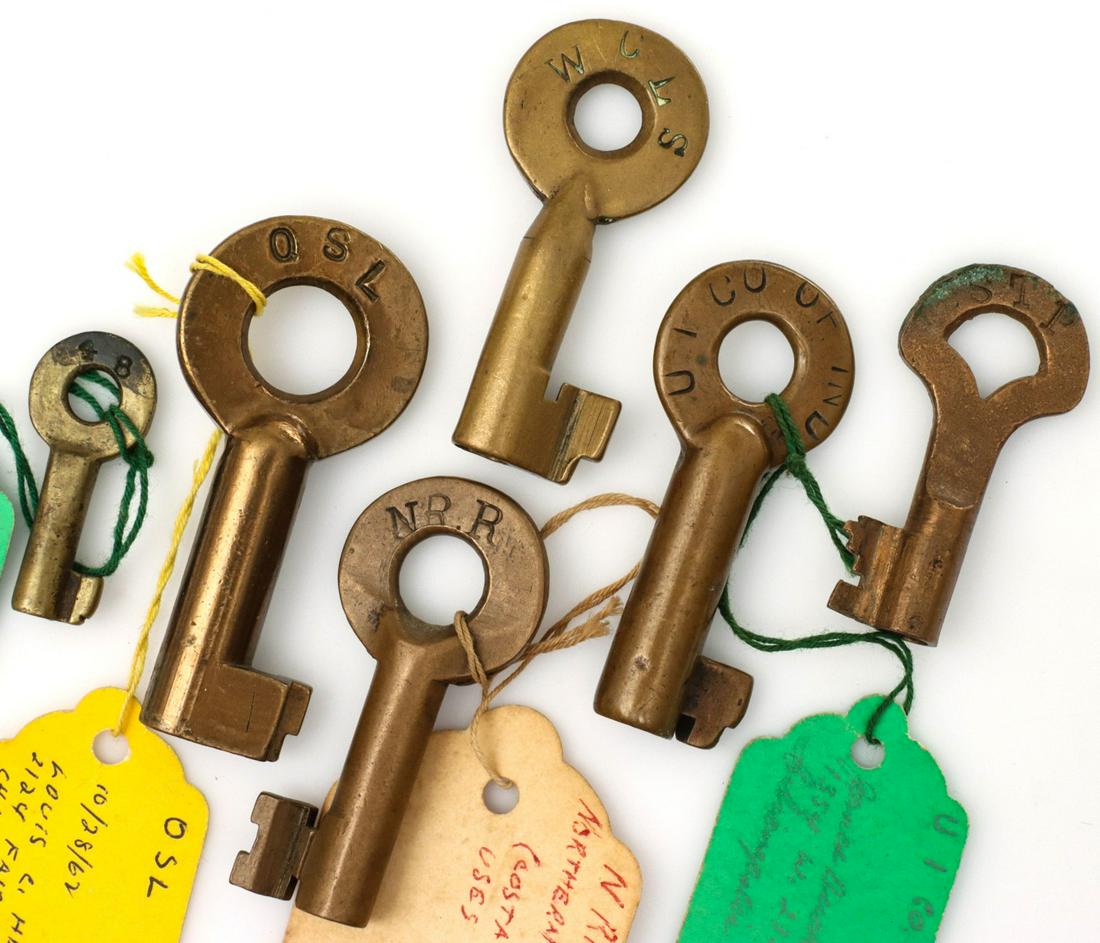 UPPER MIDWEST AND OTHER RAILROAD SWITCH KEYS: The six brass keys with stamped markings: WCLS for Wisconsin Central Lines with tapered barrel; UT CO OF IND, for the Union Traction Company of Indiana; NRR for the Nassau Railroad Company (a New York