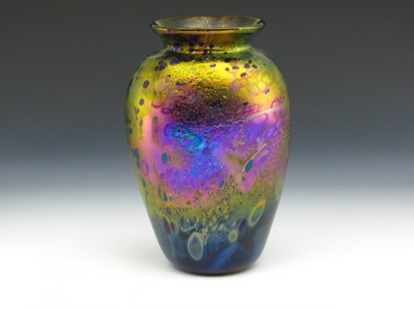 SIGNED ALLISON IRIDESCENT ART GLASS VASE: Iridescent purple and gold with lines and shapes in white, cobalt and maroon, inspired by Allison's painting background, signed 'A. Allison, #9813,' stands 8.5 inches.