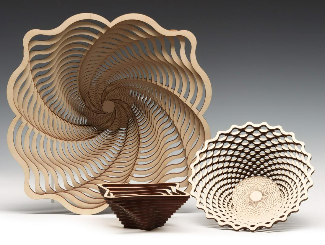 ROB JONES FRETTED BALTIC BIRCH BASKETRY BOWLS: The late 20th century laser cut bowls and votive as shown. Sizes range from 5 x 16.5 to 2.5 x 5.75 inches. We happily provide seamless in-house packing and shipping services on nearly everything we se