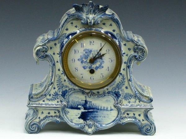 ROYAL BONN 'DELFT' CHINA CLOCK WITH FRENCH WORKS: DELFT' is both the style and the actual name of this china case as it is signed inside under the glaze. The markings read ROYAL BONN ' DELFT' 5228. The case is incredible with its abundant hand painte