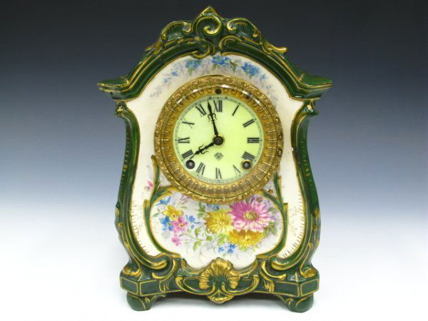 ANSONIA ANTIQUE CLOCK IN ROYAL BONN CHINA CASE: A fine antique Ansonia clock movement in the 'La Lille' pattern signed Royal Bonn china case. Measures 11 x 8 x 4.5 inches