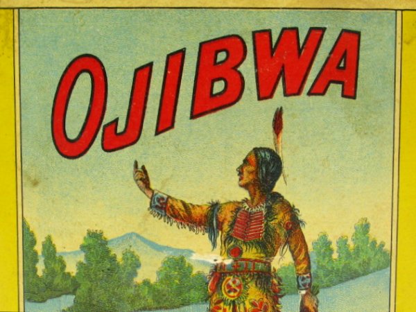 FINE EARLY 20TH C OJIBWA FINE CUT TOBACCO CAN: Color printed paper label on tin can, with swivel wire handle, measures 6 x 5 inches.
