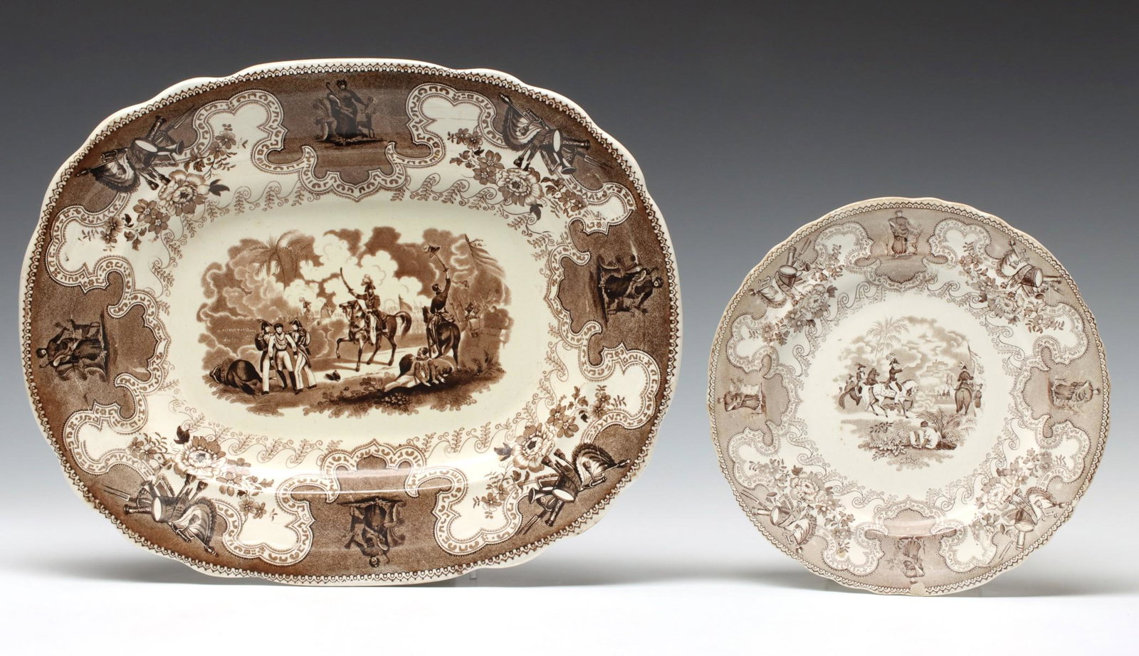 PURPLE, RED, PINK TRANSFER WARE INCL TEXIAN CAMPAIGNE: The transfer ware piece as shown, along with an early creamware teapot having major restoration. Sizes range from 5.25 to 11.5 x 10.5 inches. We happily provide seamless in-house packing and shipping