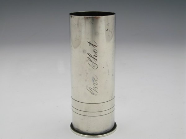A VINTAGE STERLING SHOTGUN SHELL JIGGER: A shotgun shell shot jigger that measures 3"x 1 1/8", 41 g., monogram of "One Shot" on side, marked 'sterling' to the base.