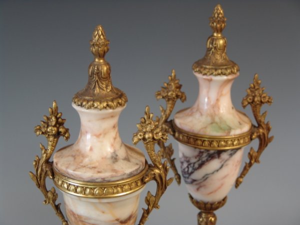 PAIR OF BRONZE DORE' MARBLE GARNITURE: Stand 14 inches each, polished marble with bronze dore' trim, four feet to each base, inset laurel brances to front of each.