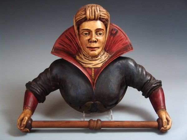 AN ANTIQUE AUSTRIAN CARVED TOWEL RACK: Carved and painted wood rack measuring 16 X 19 inches.