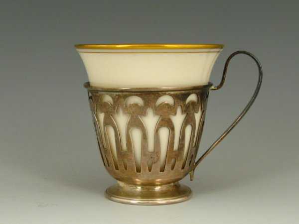 12 GREEN MARK LENOX DEMITASSE CUPS IN STERLING: Twelve Demitasse cups, Lenox porcelain inserts with the 1930's green wreath mark, each with it's fitted sterling silver frame, measuring 2" tall and 3" across including the handle, total weight of the