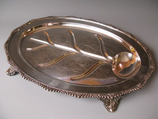 AN 1898 GORHAM STERLING SILVER MEAT TRAY: A heavy footed meat tray with tree well measures 22 1/4" x 15 1/2", 2924 grams, monogram along one edge, date mark for 1898.