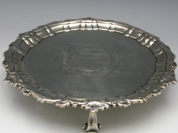 A DUBLIN STERLING SILVER SALVER CIRCA 1768: A footed salver that measures 7 1/4" and weighs 309 g., It bears the marks of Dublin, Hibernia, and maker's mark that attributes it to Richard Tudor, no date mark present, circa 1768, no monogram.