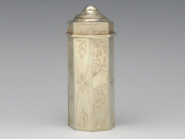 A 19th CENTURY STERLING SILVER NUTMEG GRATER: Continental hallmark to the bottom edge, hinged top releases and unfolds to grate, 1"x 2 1/2", 46 g., No monogram.