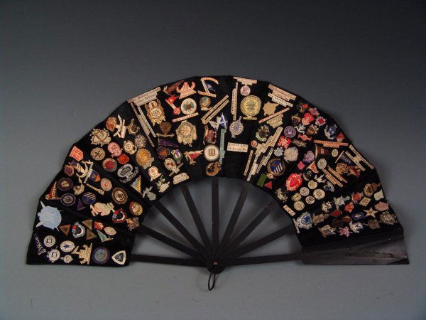 HAND FAN WITH SCHOOL, CLUB, TRAVEL, ST. JOSEPH LOGOS: An antique hand fan decorated with circa 1900 logo and monograms for Colleges, Universities, Travel Destinations, clubs in St. Joseph, Missouri and beyond.