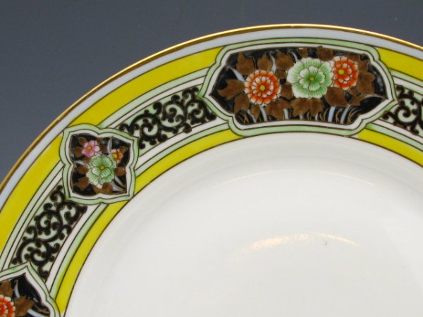 NORITAKE NIPPON HAND PAINTED SERVICE PLATES: Nine plates, each with the Morimatsu Brothers green wreath mark pre- 1910, measurement of 11.25 inches in diameter.