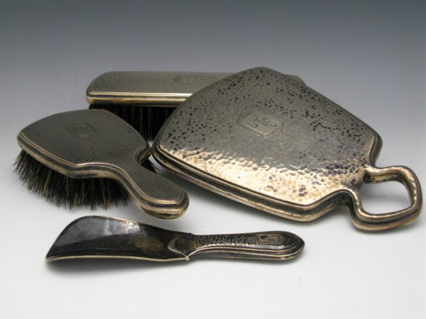 JOHN TOWNSEND SMITH'S STERLING DRESSER SET: Four piece dresser set, Wallace sterling marked 199-59. Brush with handle measures 7 3/4" x 3 1/8", Brush that is 7 1/2" x 2 1/2", Shoe horn 6" x 1 3/4" and a hand mirror that is 8" x 5".