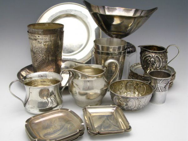 A LARGE LOT OF STERLING SILVER TABLE WARE: An entire lot including Peruvian tumblers, Sanborns Mexico coasters, creamer, sugar, 6" Continental silver plates, etc. all with a total weight of 1782 g.