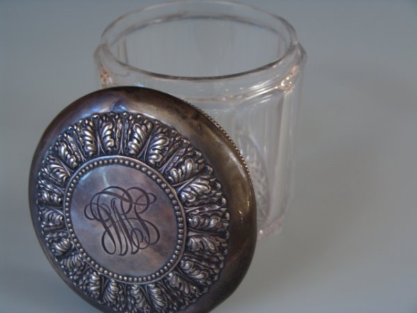 ANTIQUE CUT GLASS HUMIDOR W/GORHAM STERLING COVER: 5.5 inch tall clear glass humidor, ten flat-panel sides, star cut bottom, with well marked Gorham sterling lid, monogrammed to center top, measures 5.75 inches in diameter.