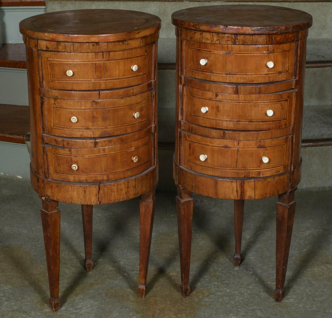 A RARE PAIR OF 18TH CENTURY ITALIAN DRUM FORM COMMODES: The circular tops overhanging the conforming case with three drawers, strung with boxwood on top, sides and drawer fronts, turned bone pulls, the whole raised on three tapered legs with block sabot fo