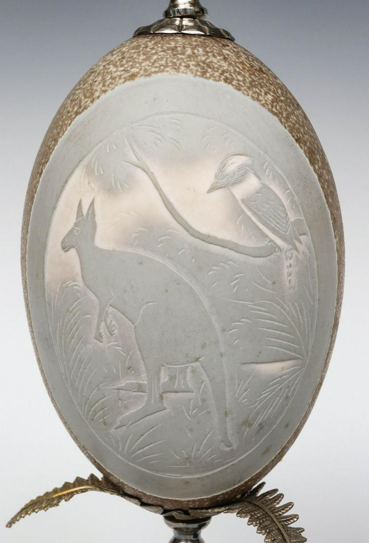 A PAIR OF CARVED EMU EGGS IN METAL MOUNTS CIRCA 1900 (1 of 9)