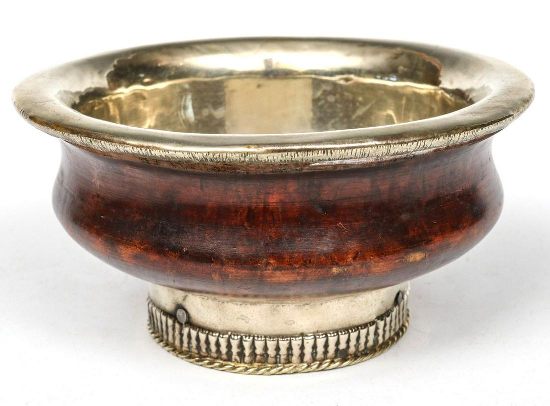 A 19TH CENTURY TIBETAN METAL MOUNTED BOWL ON STAND (1 of 6)