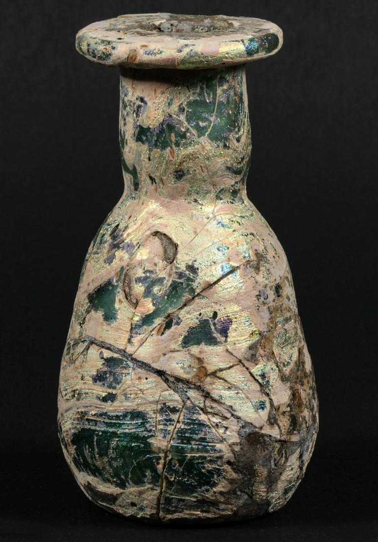 A SMALL ROMAN GLASS BOTTLE VASE (1 of 9)