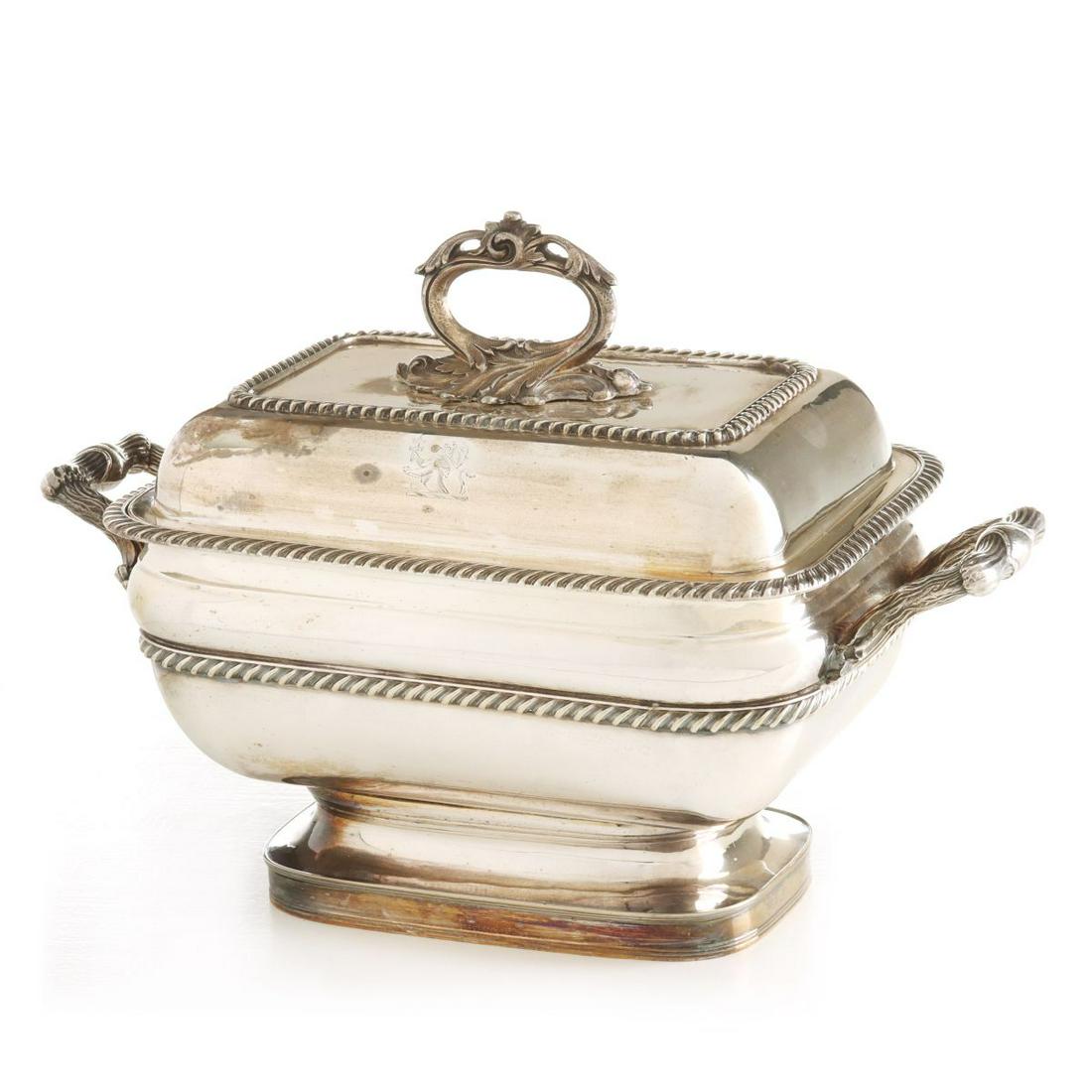 A HANDSOME OLD SHEFFILED PLATE SILVER TUREEN: The fine example in proportion and detail has a nice removable stipped acanthus handle atop the cover with family crest and gadrooned edge trimmings, the body with canted sides and more gadroon patter