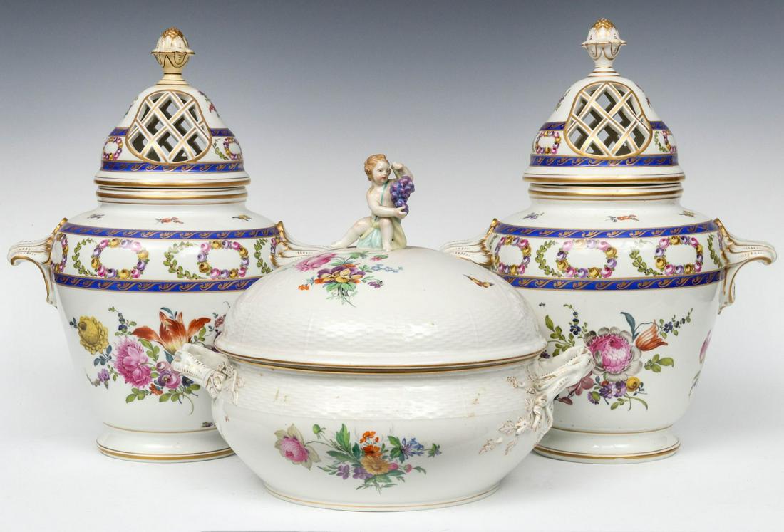 OUDE LOOSDRECHT POTPOURRI WITH A KPM COVERED DISH: The Continental porcelain group includes a pair of large porcelain urn vases capped with lattice covers topped by acanthus buds on tapering body with rococo handles and fine hand painted florals, each
