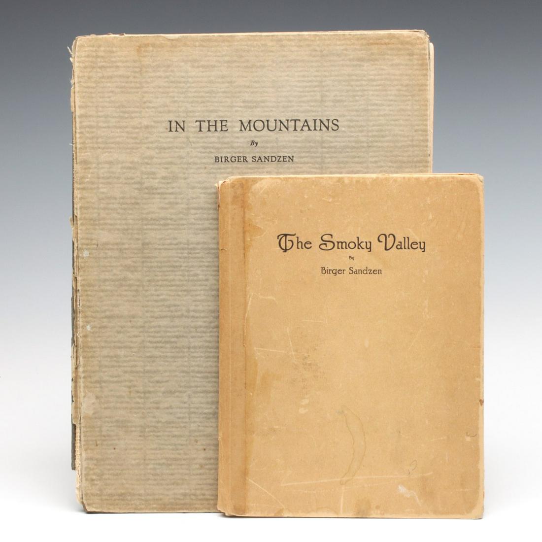 BIRGER SANDZEN BOOKS INCLUDING ONE SIGNED VOLUME: Birger Sandzen (1871 - 1954) In The Mountains: Reproductions of Lithographs and Wood Cuts of the Colorado Rockies' and 'The Smoky Valley' Circa 1920s. In The Mountains is number 921 of one thousand fi