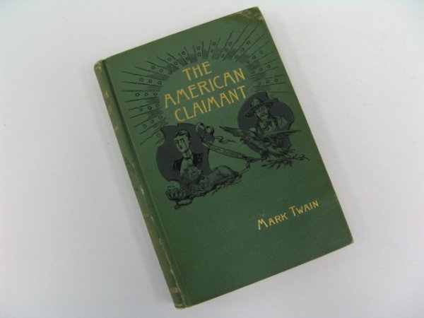 Twain. THE AMERICAN CLAIMANT.: Twain, Mark. THE AMERICAN CLAIMANT. Charles L. Webster and Co. 1892. Small Octavo. Gilt on pictorial covers. Minor fraying to upper and lower spine, spot on front cover. "No weather found in the book"