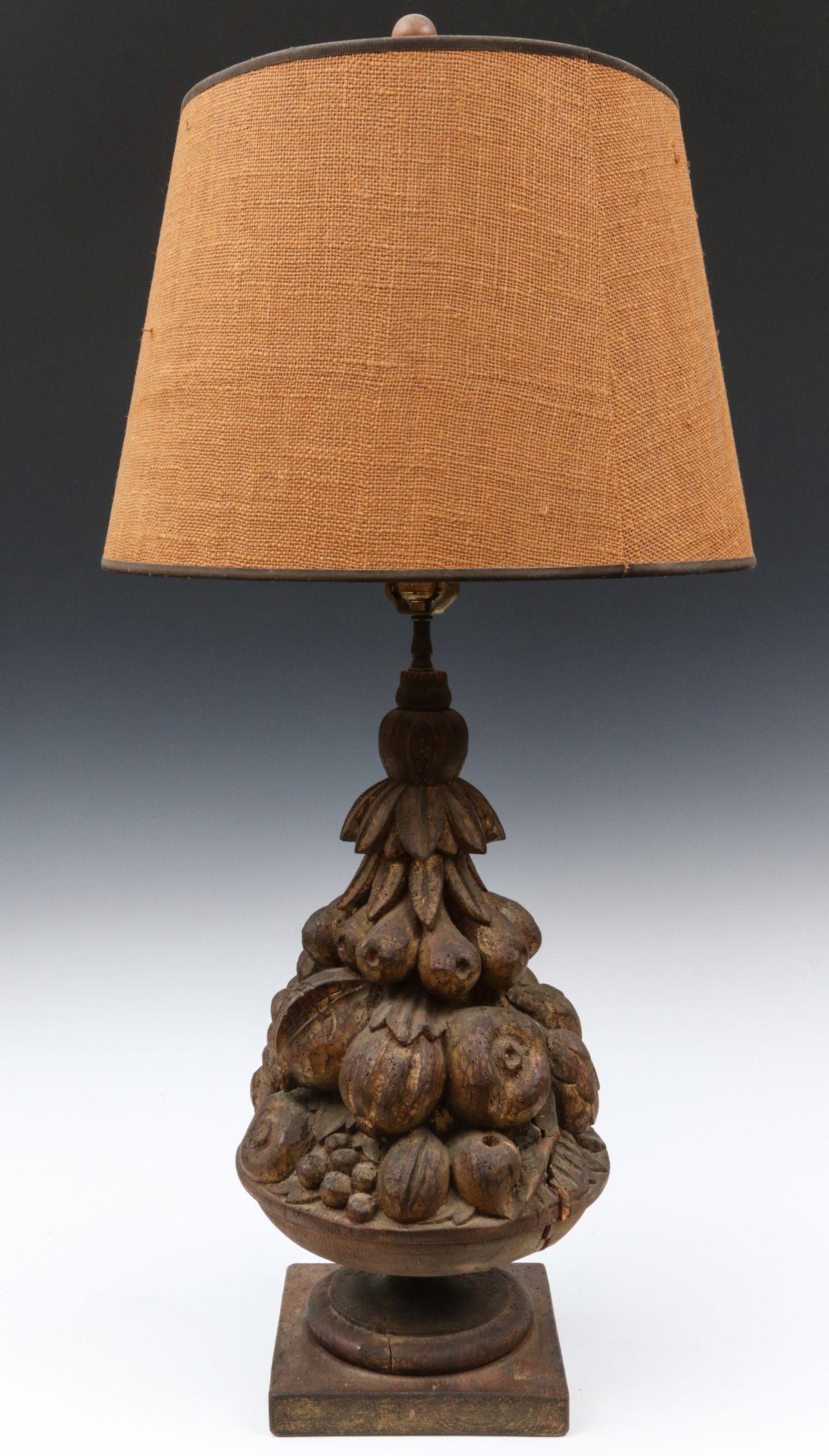 AN 18TH/19TH C. FRENCH CARVING NOW A TABLE LAMP: The carved fruit compote finial with slightly encrusted finish displaying traces of gilding on thin wood block wired with central lighting apparatus. Measures 36 x 18 x 18 inches. We happily provide s