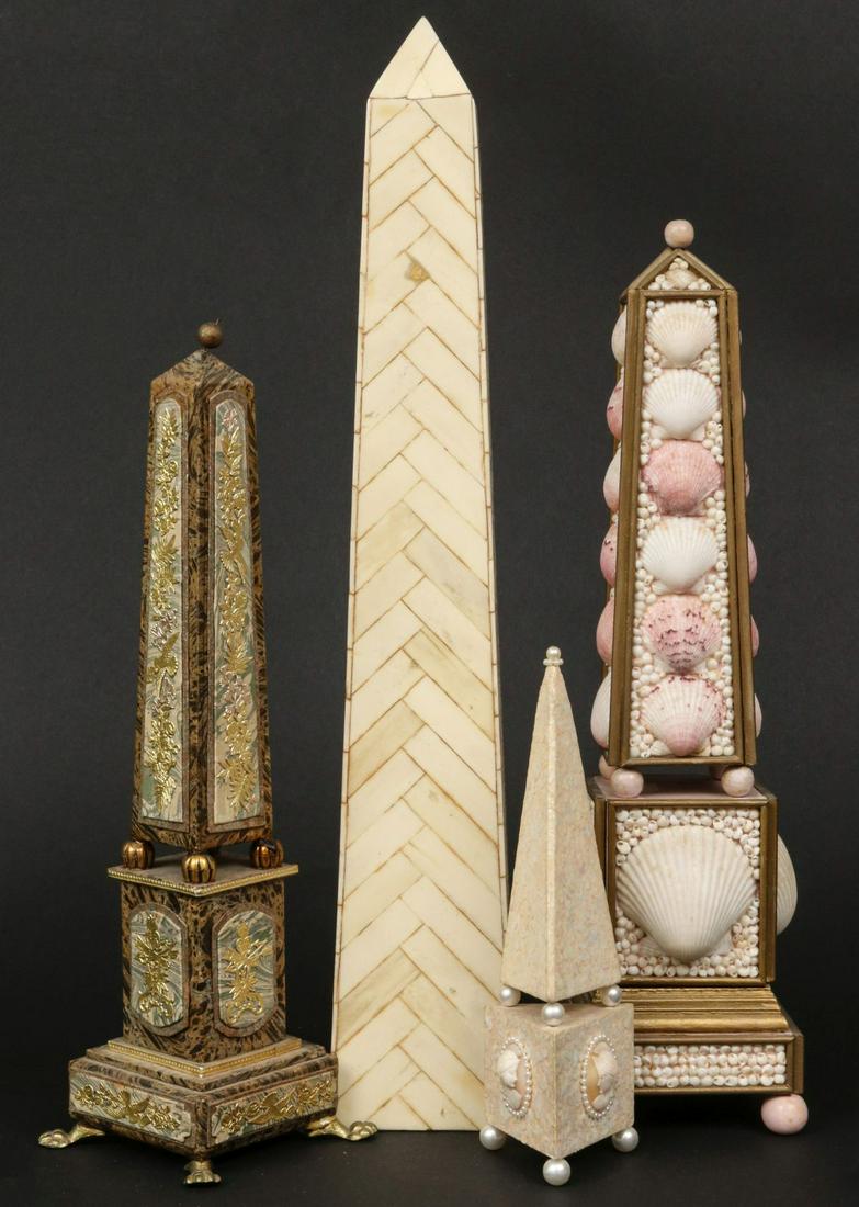 A COLLECTION OF FOUR DECORATIVE OBELISKS: 1. A semi-antique example with marbled papers and brass mounts. 2. An example with bone veneer. 3. The smallest example is embellished in bits of shell pearls and three carved shell cameos. 4. The sec