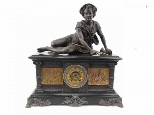AN ANSONIA 'COLUMBIA' MANTLE CLOCK WITH STATUE: One of Ansonia's top of the line Mantle Clock models, these rare statue clocks were originally offered in a variety of finish combinations. On this particular example, the gold finish of the highly de