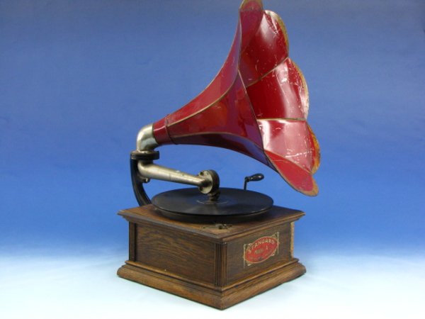 VICTOR STANDARD MODEL A PHONOGRAPH WITH MORNING GLORY H: 10 inch inch turntable on 5.75 x 11.25 x 11.25 inch oak case with 17.5 inch diameter red with gold painted trim morning glory horn.