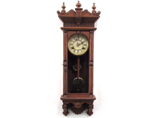 A WATERBURY 'BROCKVILLE' REGULATOR WALL CLOCK: Oak case in original finish, original 6 inch dial, two good 100% labels on the reverse, time and strike, 8-day, measures 33 x 12 x 5 inches.