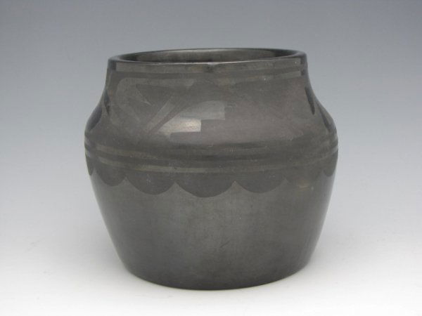 TONITA ROYBAL SAN ILDEFONSO BLACK POTTERY JAR: Rare black-on-black pottery jar by Tonita Roybal, first of the San Ildefonso potters to adopt the black on black style that was developed by Maria and Julian Martinez. Before then Roybal had worked wi