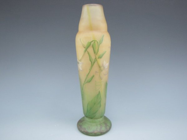 A DAUM NANCY FRENCH CAMEO GLASS VASE: A 12.75 inch vase, internally colored with cameo decoration of wildflowers in enamels of white, greens and yellows.