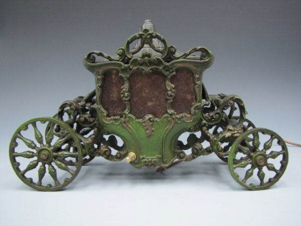 CAST IRON FRENCH CARRIAGE FIGURAL LAMP: Nicely cast iron coach with mica windows, rolling wheels, refitted with new socket and turn switch, works fine. Removable top for light access, measures 10 x 15.75 x 5 inches.