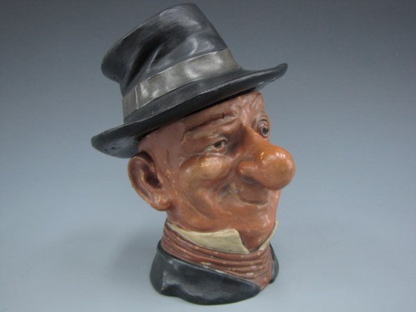 AUSTRIAN FIGURAL HUMIDOR OF ALLY SLOPER: Ally Sloper English cartoon figure with large nose and wide-open eye, slightly crushed top hat, faintly marked to bottom. Measures 7 x 5 inches.