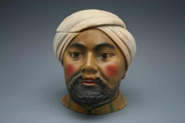 FIGURAL HUMIDOR WITH ORIENTAL MAN IN TURBAN: Unmarked bisque humidor with painted details, measures 4.5 inches tall.