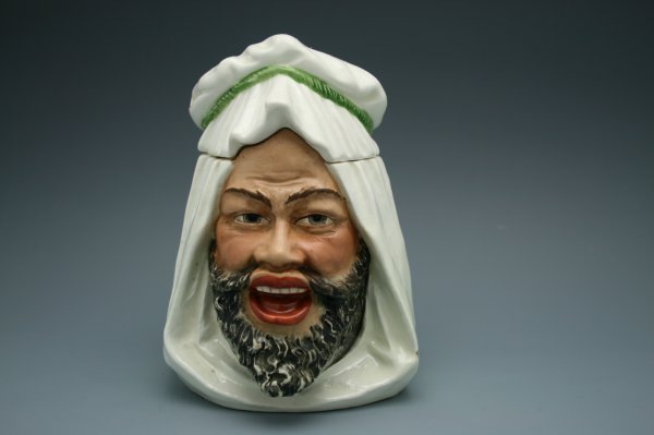 AN ARAB BEDOUIN FIGURAL HUMIDOR: Nice character humidor of man in white keffiyeh, incised numbers to bottom, measures 6.5 inches.