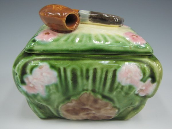 MAJOLICA TOBACCO HUMIDOR WITH PIPE LID: Rectangular majolica humidor with pipe on lid, measures 4 x 5 x 3.5 inches, unmarked.