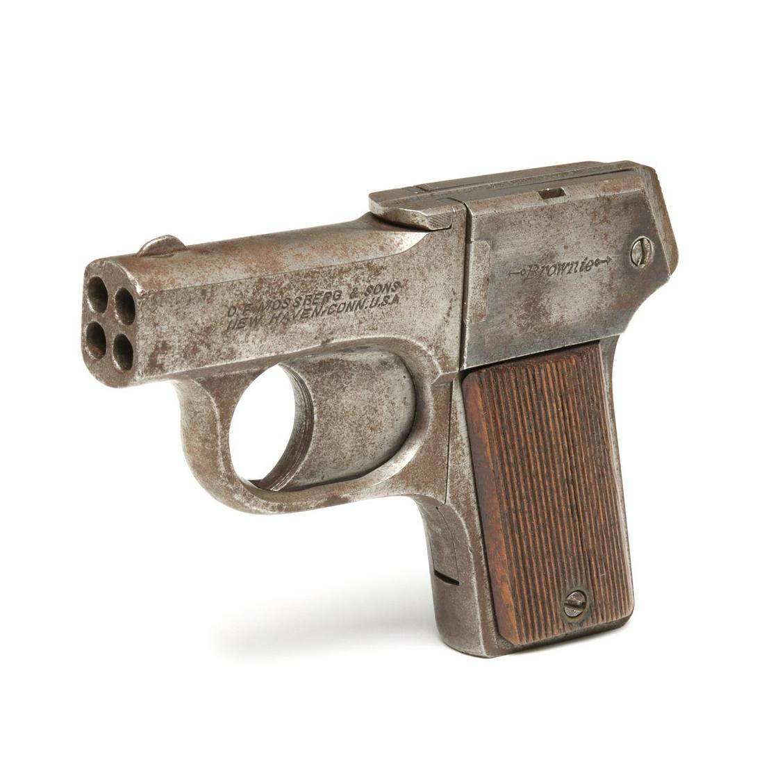 A MOSSBERG BROWNIE PEPPERBOX PISTOL: Brownie 22 Pepperbox (serial #:5586) The left side of the barrel is marked 'O.F. MOSSBERG & SONS/NEW HAVEN, CONN. U.S.A.' and the frame is marked BROWNIE, left side is marked PAT APPLD FOR , blade fro