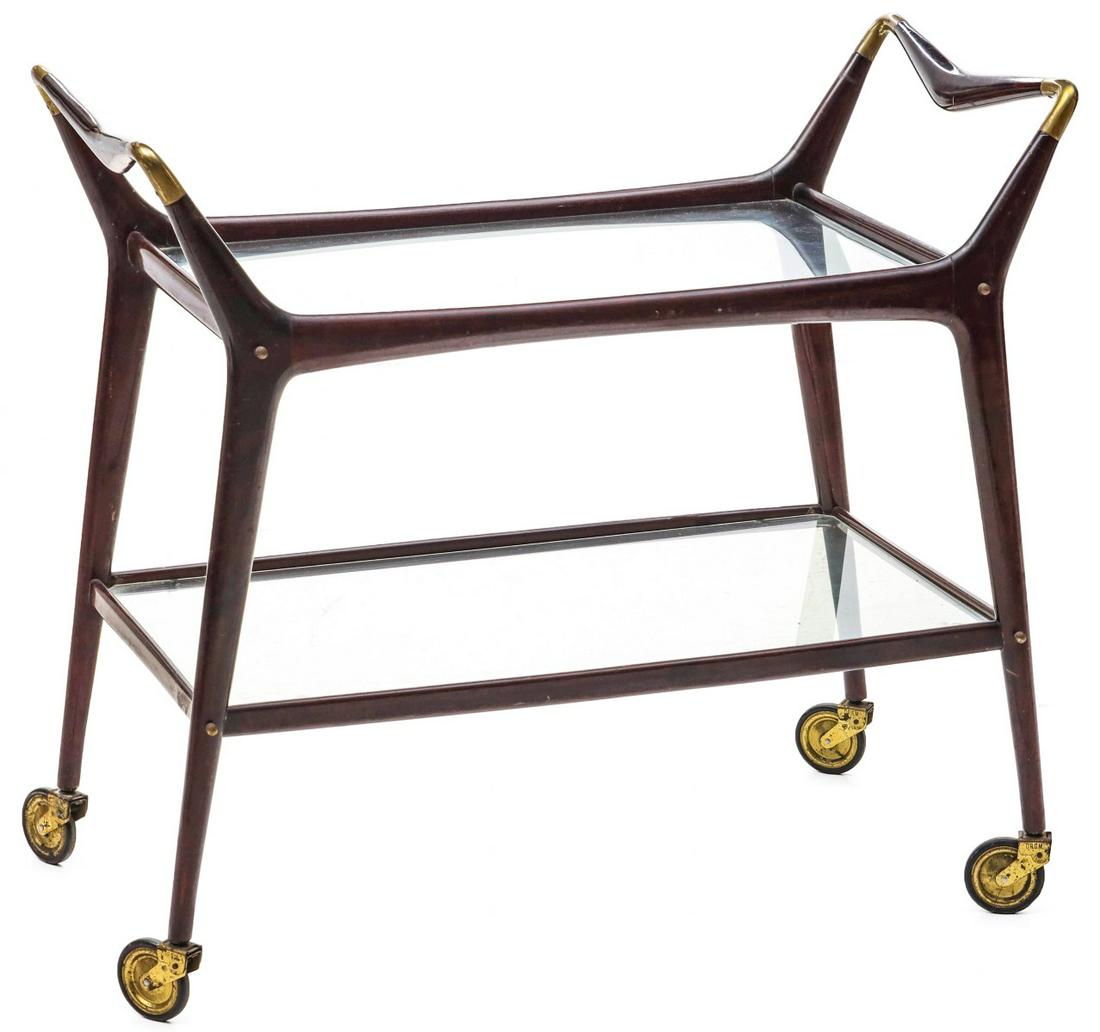 A MID 20TH CENTURY ICO PARISI MAHOGANY SERVING TROLLEY: The Italian two-tier mahogany and brass serving trolley or bar cart designed by Ico Parisi for Angelo De Baggis Furniture Company circa 1950s. Measures 32.5 x 35.75 x 18 inches. Please be aware that t